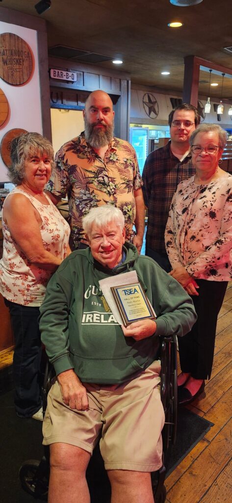 Photo of Andy Martin receiving his TSEA Hall of Fame Plaque at his local TSEA Three Rivers Chapter meeting after being inducted into the TSEA Hall of Fame at the 2026 RA in June 2026